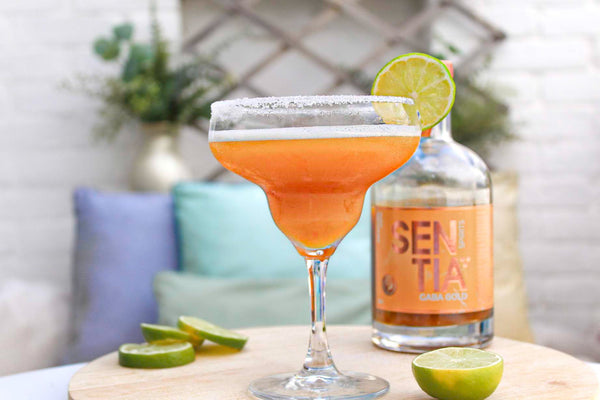 Image of the Margarita with a bottle of Sentia Gold in the background